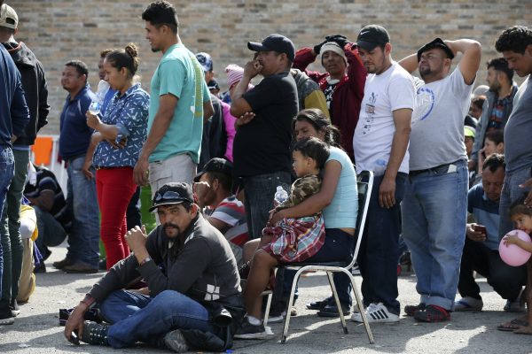 immigrants line up to register