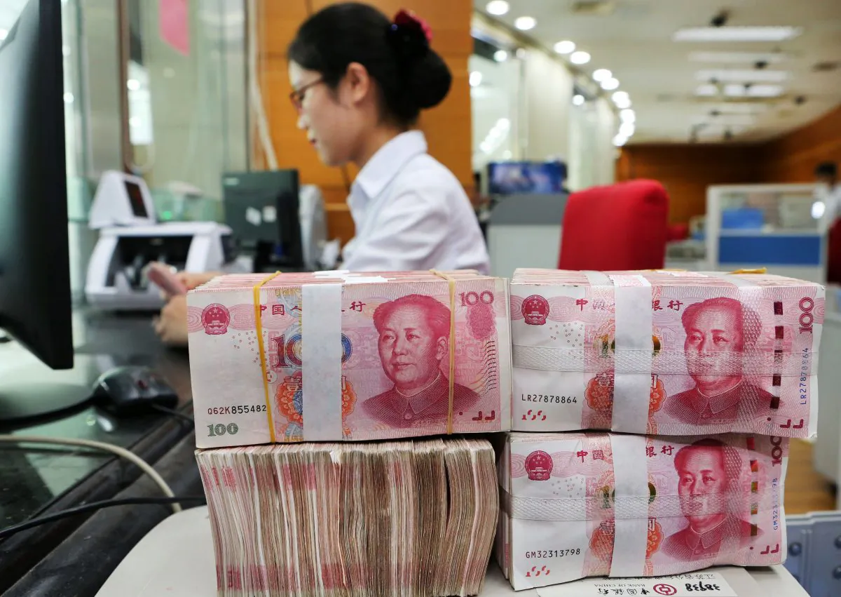 100-yuan notes sit at a bank in Nantong City, in eastern China's Jiangsu Province on July 23, 2018. (AFP/Getty Images)
