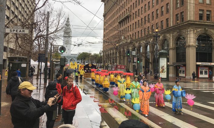 Falun Dafa practitioners march down Market Street in San Francisco to celebrate Chinese New Year on Feb. 9, 2019. (Ilene Eng/The Epoch Times)