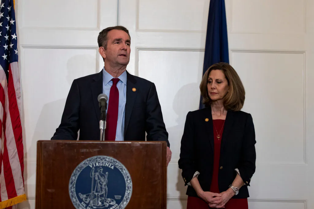 Virginia Governor Ralph Northam, flanked by his wife Pam, speaks with reporters at a press conference at the Governor's mansion in Richmond, Virginia, on Feb. 2, 2019. (Alex Edelman/Getty Images)