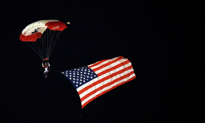 A skydiver flies with the American flag prior to the NASCAR Camping World Truck Series JAG Metals 350 at Texas Motor Speedway on Nov. 2, 2018 in Fort Worth, Texas. (Josh Hedges/Getty Images)