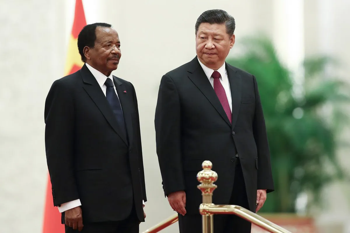 Chinese Leader Xi Jinping (L) welcomes Cameroon President Paul Biya in Beijing on March 22, 2018. The Chinese regime wrote off $78 million in debts from Cameroon but didn't report it.. (Lintao Zhang/Getty Images)