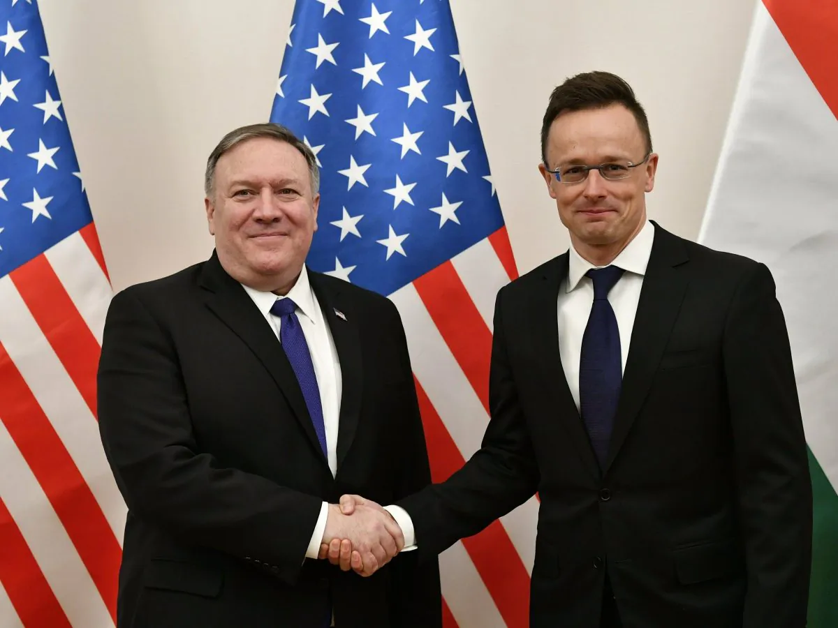 Hungarian Minister of Foreign Affairs and Trade Peter Szijjarto, right, shakes hands with U.S. Secretary of State Mike Pompeo in the ministry in Budapest, Hungary, on Feb. 11, 2019. (Zsolt Szigetvary/MTI via AP)