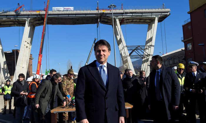 Italy's Prime Minister Giuseppe Conte arrives to visit the collapsed Morandi Bridge in Genoa, Italy, on Feb. 8, 2019. (Massimo Pinca/Reuters)