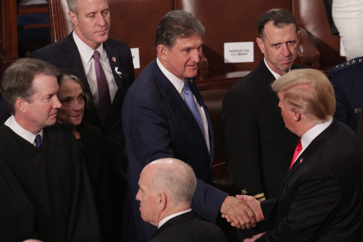 manchin shakes trump hand