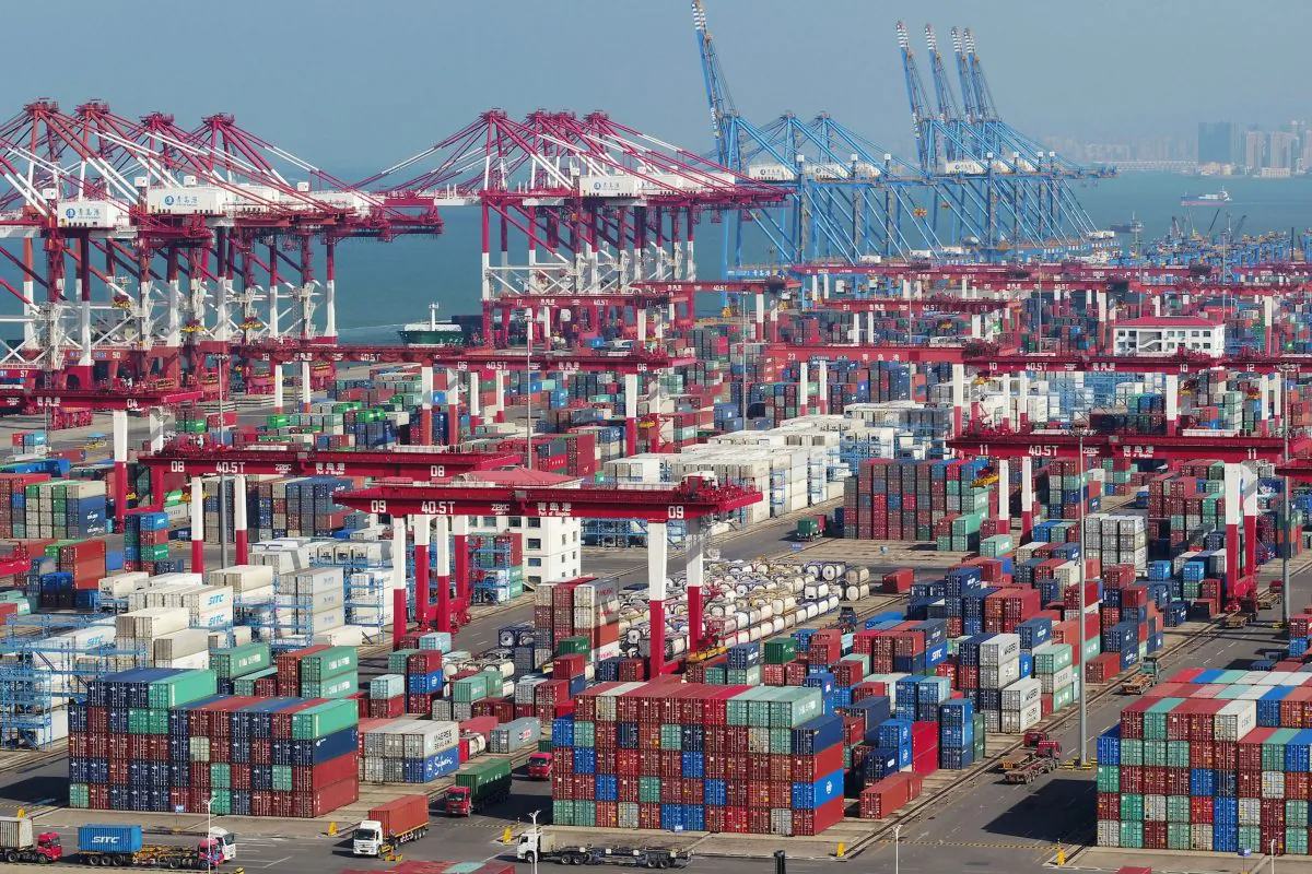 Containers and trucks are seen at a terminal of the Qingdao port in Shandong Province, China on Nov. 8, 2018. (Reuters)