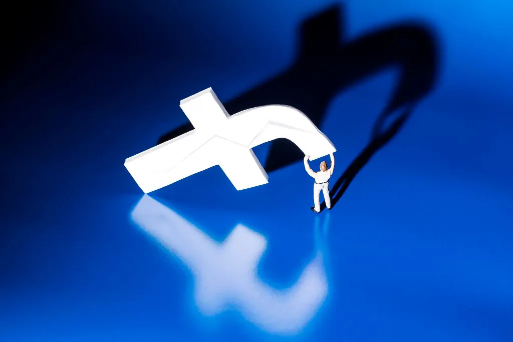 This photograph taken on May 16, 2018, shows a figurine carrying the logo of social network Facebook in Paris. (JOEL SAGET/AFP/Getty Images)