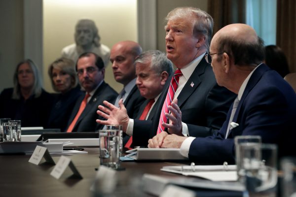 President Donald Trump talks to reporters