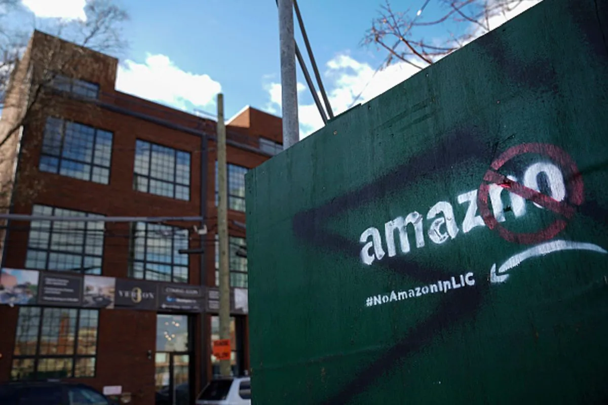 A protest message directed at Amazon is spray painted on a wall near a construction site in the Long Island City neighborhood of the Queens borough of New York City, on Jan. 9, 2019. (Drew Angerer/Getty Images)