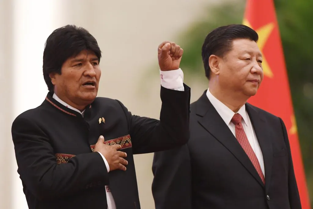 Bolivia's President Evo Morales (L) sings his national anthem as Chinese leader Xi Jinping (R) looks on during a welcome ceremony in the Great Hall of the People in Beijing on June 19, 2018. (Greg Baker/AFP/Getty Images)
