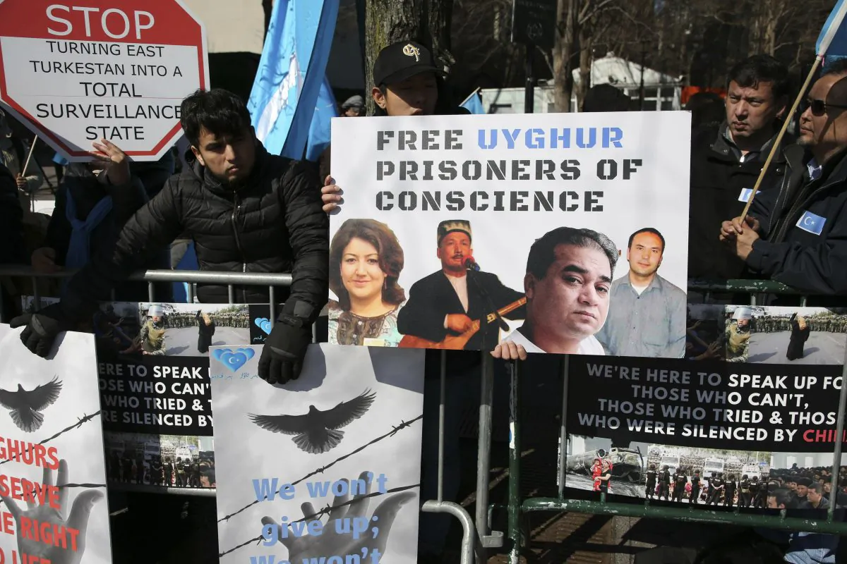 Uyghurs and their supporters rally across the street from United Nations headquarters in New York on March 15, 2018. Members of the Uyghur Muslim ethnic group are calling on the Chinese regime to post videos of their relatives who have disappeared into a vast system of internment camps. The campaign follows the release of a state media video showing famed Uyghur musician Abdurehim Heyit, who many believed had died in custody. (Seth Wenig/AP)