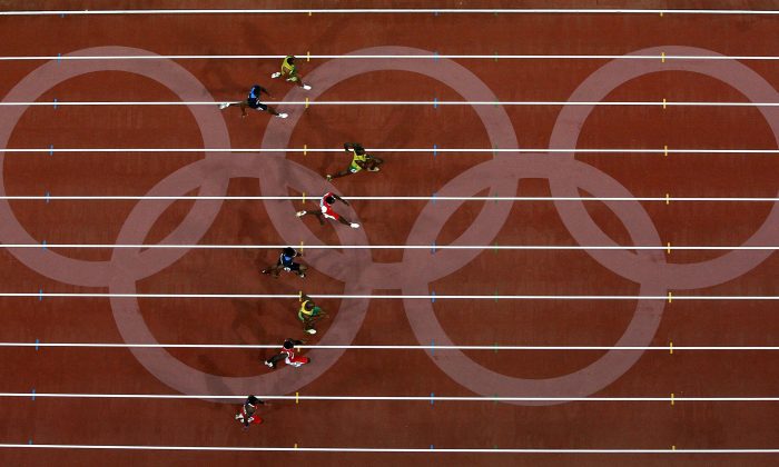 Usain Bolt of Jamaica leads the field on his way to winning the Men's 100 meter final in Beijing on Aug. 16, 2008, in Beijing, China. (Ezra Shaw/Getty Images)