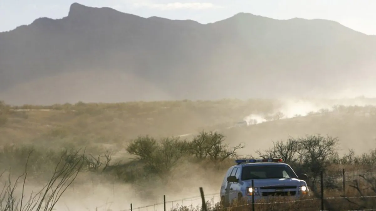 A United States Border Patrol vehicle returns from the scene of an overnight shootout where Border Patrol Agent Brian Terry was killed northwest of Nogales, Ariz., on Dec. 15, 2010. (Greg Bryan/Arizona Daily Star via AP, File)