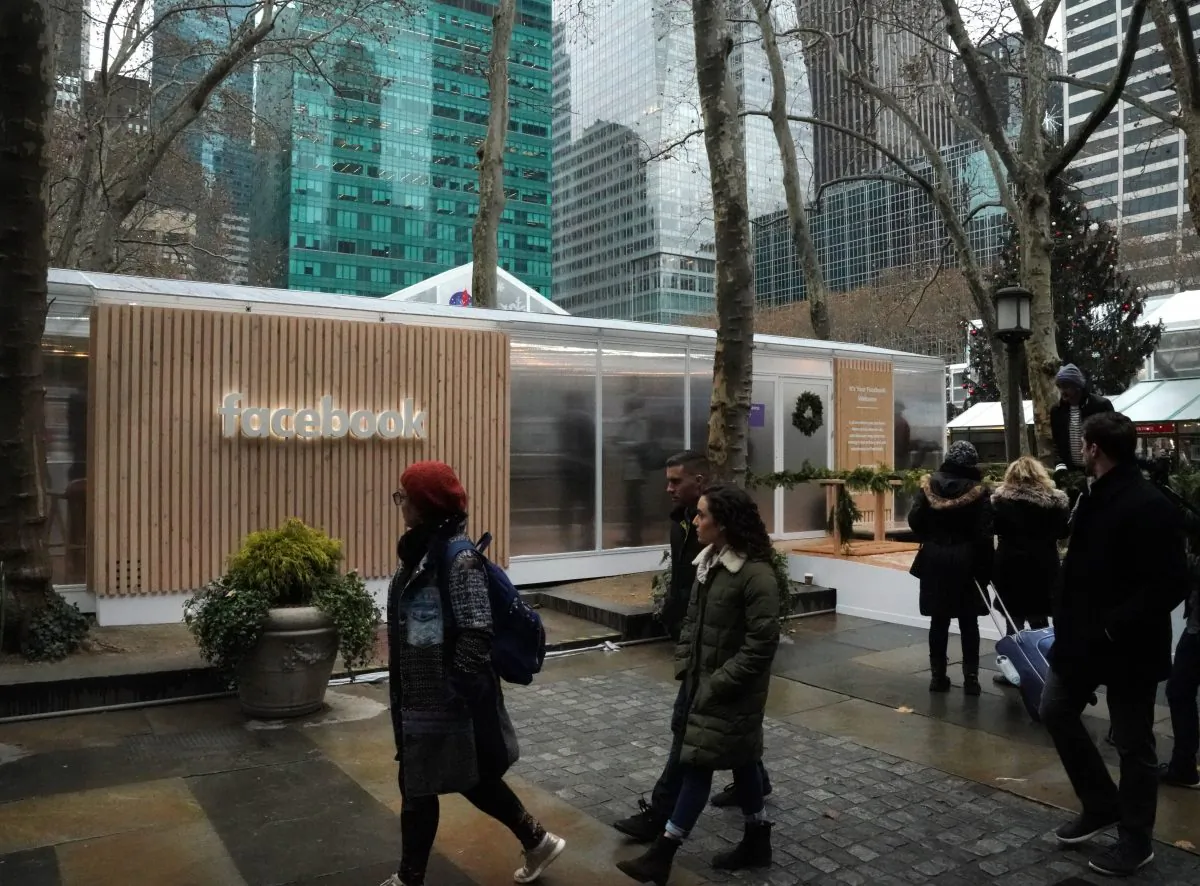 People walk by as the social network Facebook opens a pop-up kiosk for one day in Bryant Park in New York, Dec. 13, 2018, where it fields questions about its data-sharing practices and teach users how to understand its new privacy controls. (TIMOTHY A. CLARY/AFP/Getty Images)