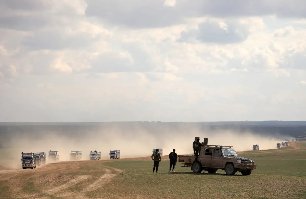 Members of Syrian Democratic Forces (SDF) stand near a pick up truck near Baghouz, Deir Al Zor province, Syria Feb. 11, 2019. (Rodi Said/Reuters)