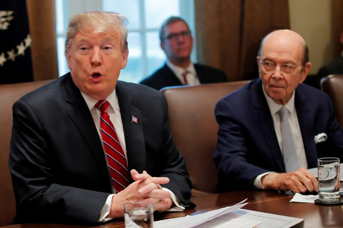 U.S. President Donald Trump speaks next to Commerce Secretary Wilbur Ross during a Cabinet meeting at the White House in Washington, U.S. on Feb. 12, 2019. (Carlos Barria/Reuters)