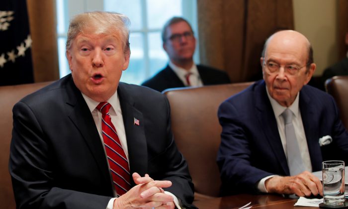 U.S. President Donald Trump speaks next to Commerce Secretary Wilbur Ross during a Cabinet meeting at the White House in Washington, U.S. on Feb. 12, 2019. (Carlos Barria/Reuters)