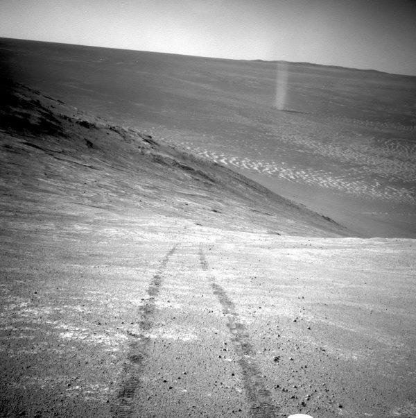 A dust devil in a valley on Mars