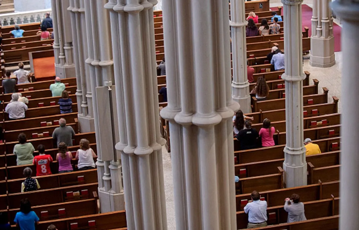 Parishioners worship during a mass to celebrate the Assumption of the Blessed Virgin Mary at St Paul Cathedral, the mother church of the Pittsburgh Diocese, in Pittsburgh, Pennsylvania, on Aug. 15, 2018. (Jeff Swensen/Getty Images)