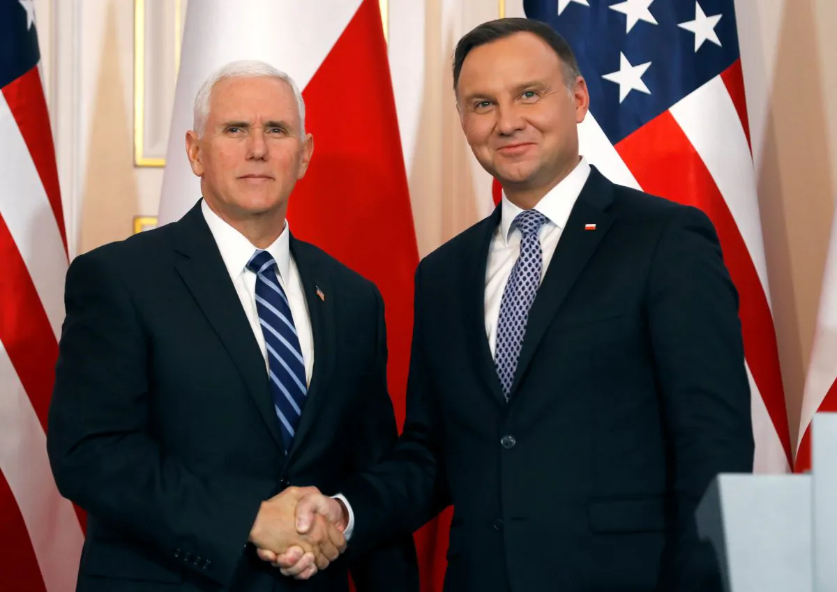 U.S. Vice President Mike Pence and Polish President Andrzej Duda shake hands during a joint news conference at Belvedere Palace in Warsaw, Poland on Feb. 13, 2019. (Kacper Pempel/Reuters)