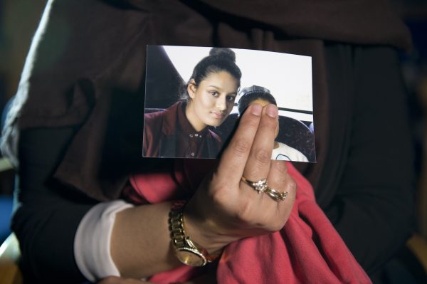 Renu, the eldest sister of Shamima Begum, holds her sister’s photo during a media interview at New Scotland Yard in London on Feb. 22, 2015. (Laura Lean/PA Wire/Getty Images)