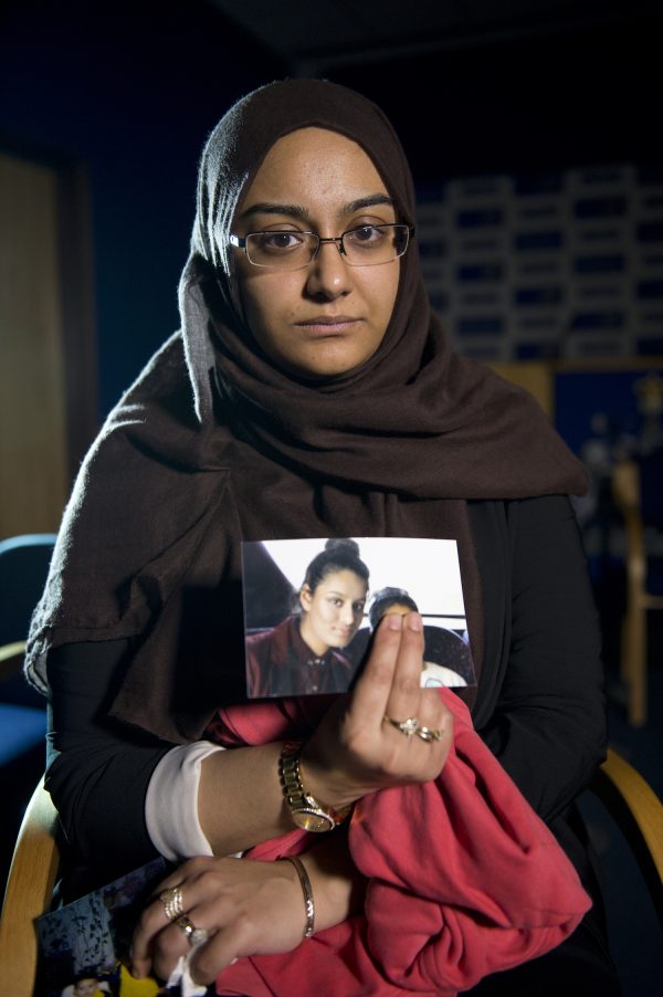 Shamima's sister holds her photo