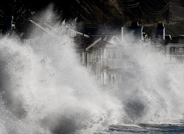 El Nino generated storm waves crash onto seaside houses