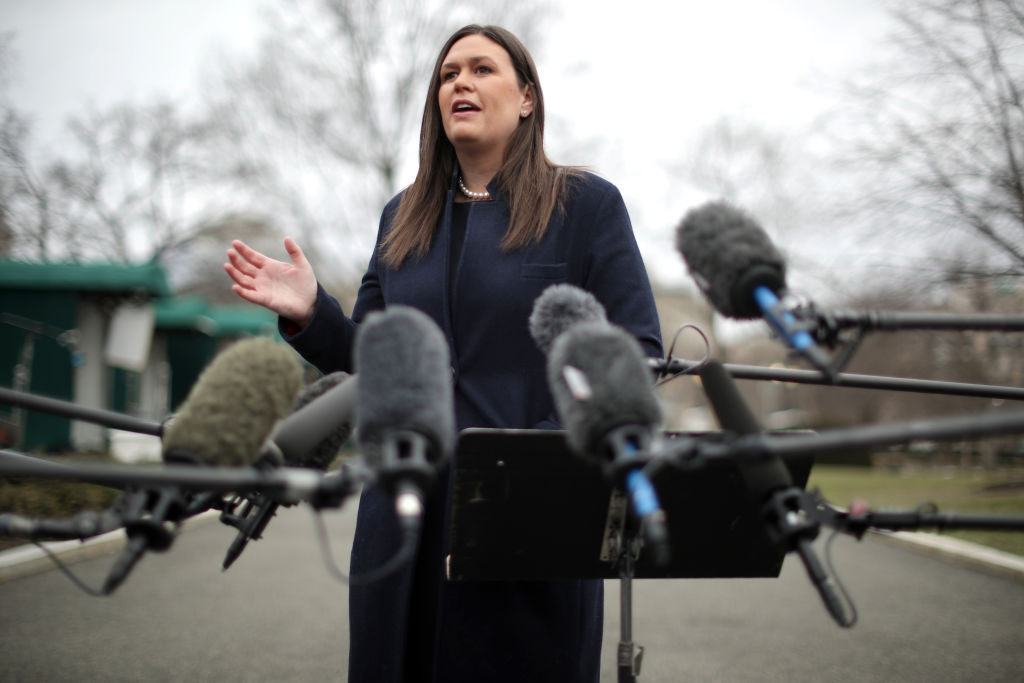 White House Press Secretary Sarah Huckabee Sanders talks to reporters