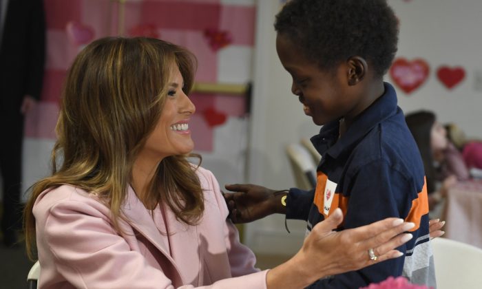 First Lady Melania Trump talks with Amani, 13, of Mombasa, Kenya, during her visit to the National Institutes of Health to see children at the Children's Inn and celebrate Valentine's Day, in Bethesda, Md., on Feb. 14, 2019. (Susan Walsh/AP)