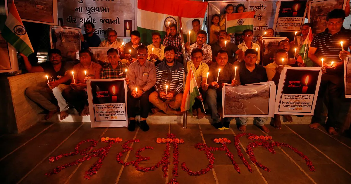 People pay tribute to Central Reserve Police Force (CRPF) personnel who were killed in an explosion in south Kashmir, inside a temple in Ahmedabad, India, on Feb. 14, 2019. (Amit Dave/Reuters)