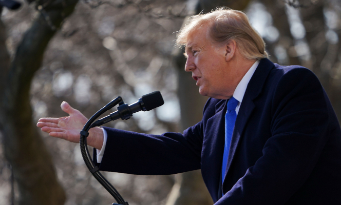 President Donald Trump gestures as he answers questions in the Rose Garden at the White House, on Feb. 15, 2019. (Brendan Smialowski/AFP/Getty Images)