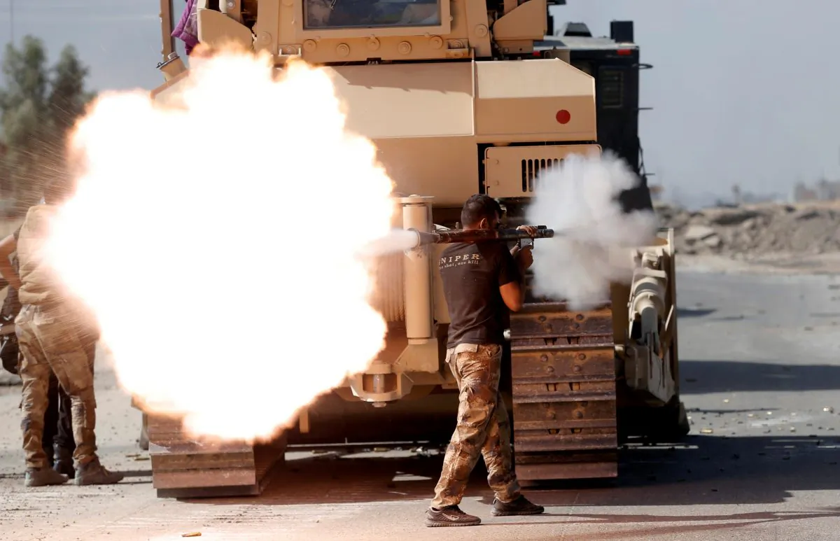 An Iraqi special forces soldier fires an RPG during clashes with ISIS terrorists in Bartella, east of Mosul, Iraq, on Oct. 20, 2016. (Goran Tomasevic/File Photo/Reuters)