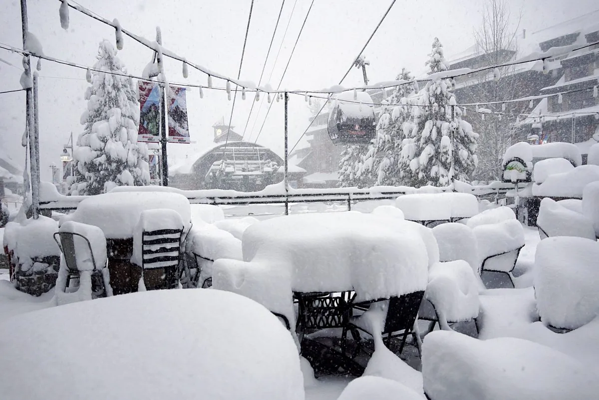 This Friday, Feb. 15, 2019, photo released by Heavenly Mountain Resort shows snow covering chairs and ski equipment at Heavenly Mountain Resort near South Lake Tahoe, Calif. (Duncan Kincheloe/Heavenly Mountain Resort via AP)