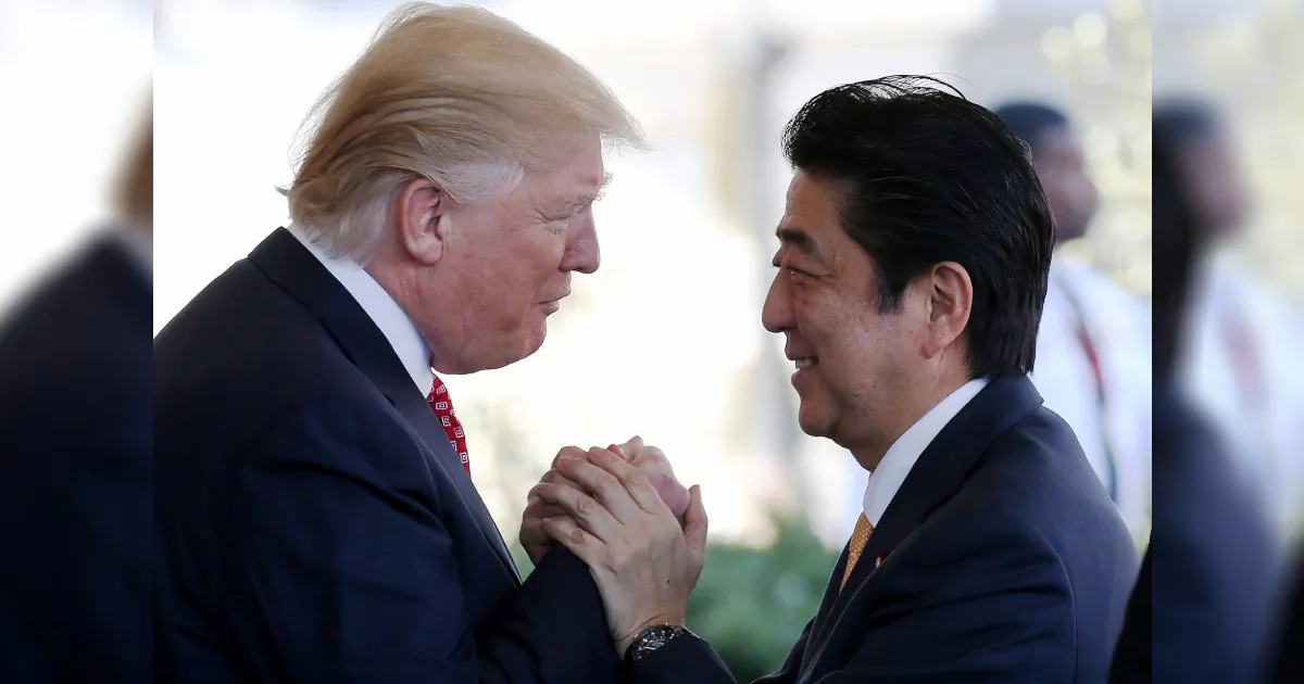 President Donald Trump (L) greets Japanese Prime Minister Shinzo Abe as he arrives at the White House on February 10, 2017 in Washington, DC. The two will hold a bilateral meeting and press conference today at the White House. (Mario Tama/Getty Images)