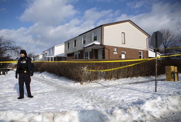 Police monitor the scene outside of a house where a young girl was found dead in Brampton, Ont. on Feb. 15, 2019. (THE CANADIAN PRESS/Andrew Ryan)