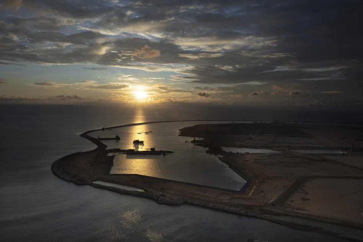 Built on land reclaimed from the Indian Ocean and funded with $1.4 billion in Chinese investment, the Colombo Port City project is seen jutting out into the ocean in Colombo, Sri Lanka, on Nov. 8, 2018. In order to pay for this development, Sri Lanka was forced to sell strategic assets to Beijing, such as the Hambantota Port.  (Paula Bronstein/Getty Images)