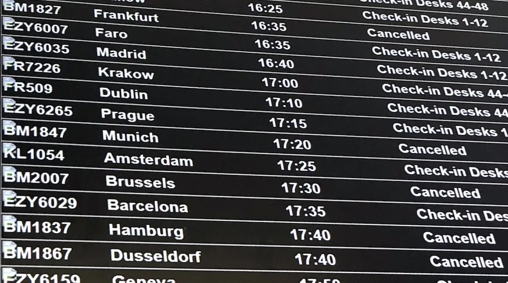 A departure board showing the BMI flights cancelled following the collapse of the airline, at Bristol Airport in Bristol, England, on Feb. 17, 2019. (PA via AP)