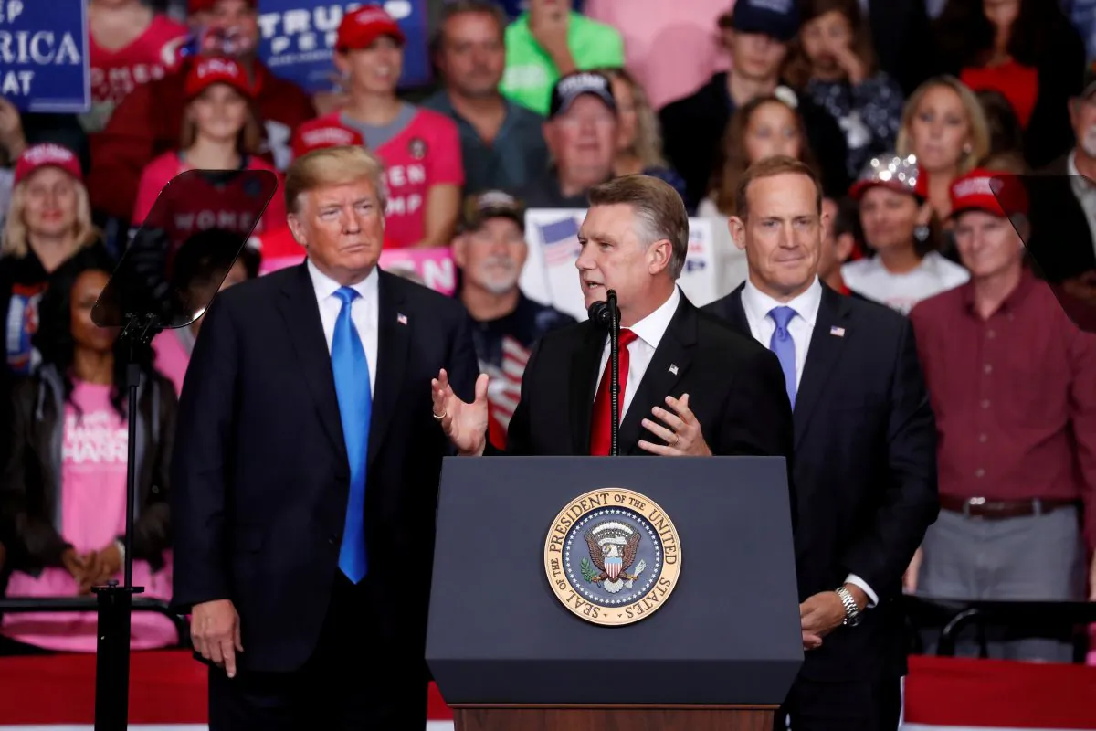 Mark Harris, Republican candidate from North Carolina's 9th Congressional district, speaks as President Donald Trump looks on during a campaign rally in Charlotte, N.C., on Oct. 26, 2018. (REUTERS/Kevin Lamarque/File Photo)