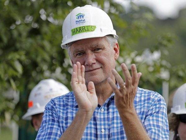 Republican congressional candidate Mark Harris applauds during a Habitat For Humanity building event in Charlotte, N.C.