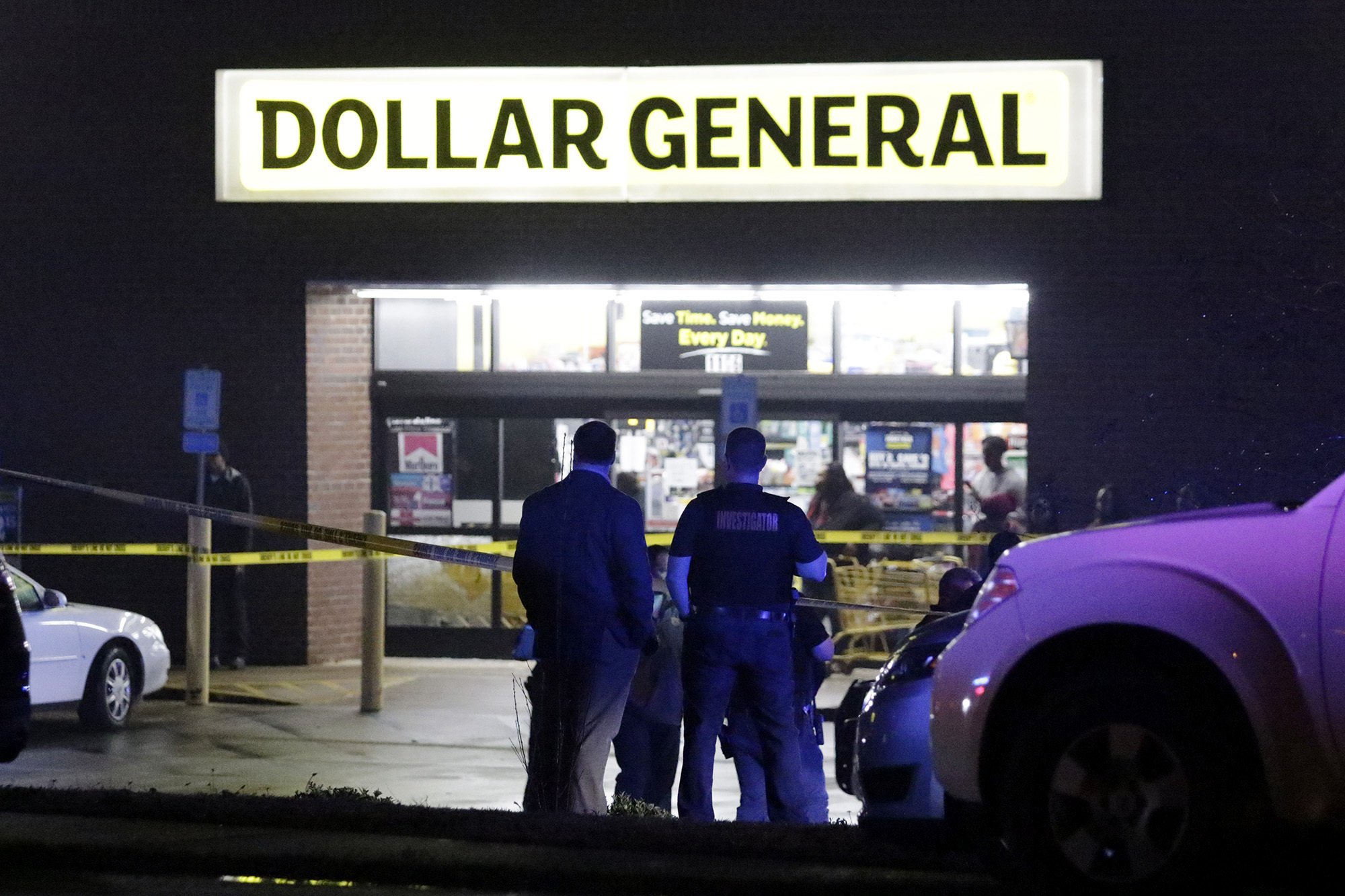 Law enforcement officers surround the Dollar General