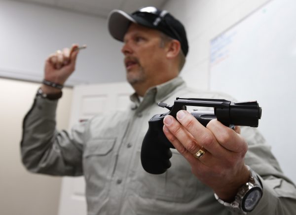 Gun instructor Mike Stilwell, demonstrates a revolver