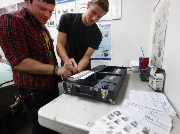 An unidentified person has his fingerprints taken as part of a concealed gun carry permit class in Utah, Jan. 9, 2016. (George Frey/Getty Images)