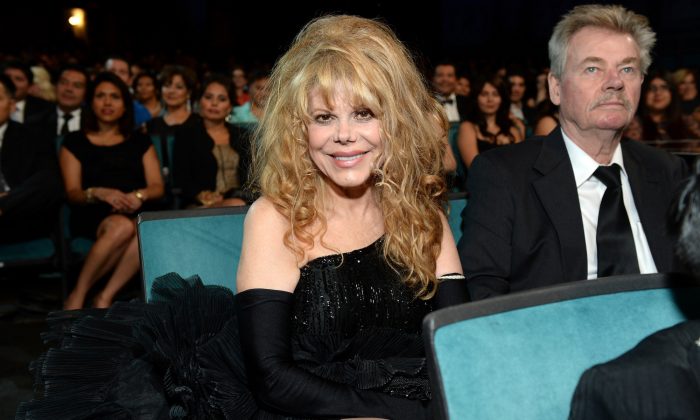 Singer Charo (L) and husband Kjell Rasten—believed to have died of a self-inflicted gunshot wound on Feb. 19, 2019—attend an awards ceremony in Pasadena, Calif., on Sept. 27, 2013. (Michael Kovac/Getty Images for NCLR)