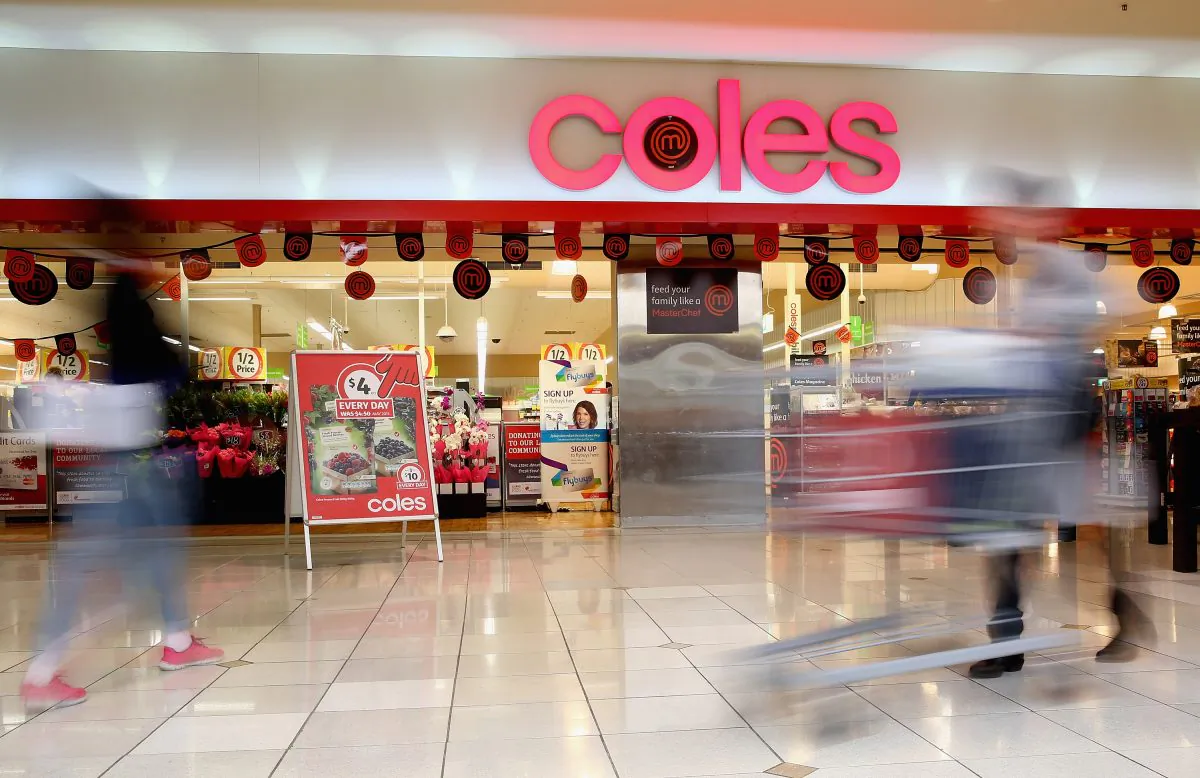 A shopper walks out of Coles supermarket on May 25, 2015 in Melbourne, Australia. (Quinn Rooney/Getty Images)