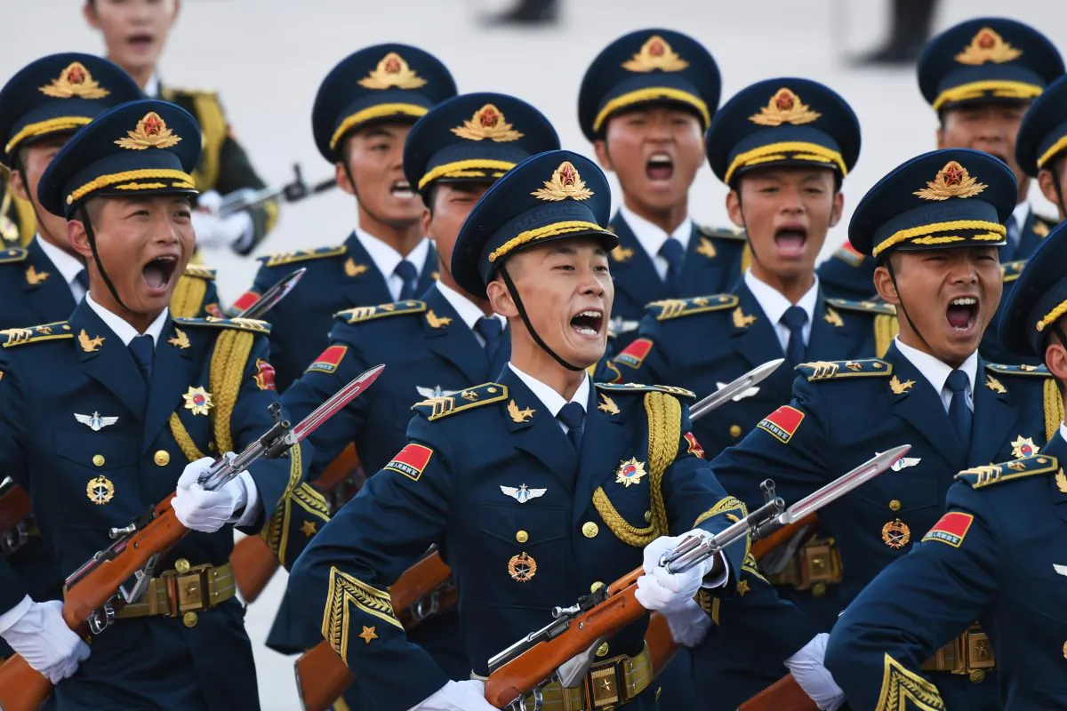 Chinese soldiers parade during a welcoming ceremony in Beijing. (GREG BAKER/AFP/Getty Images)