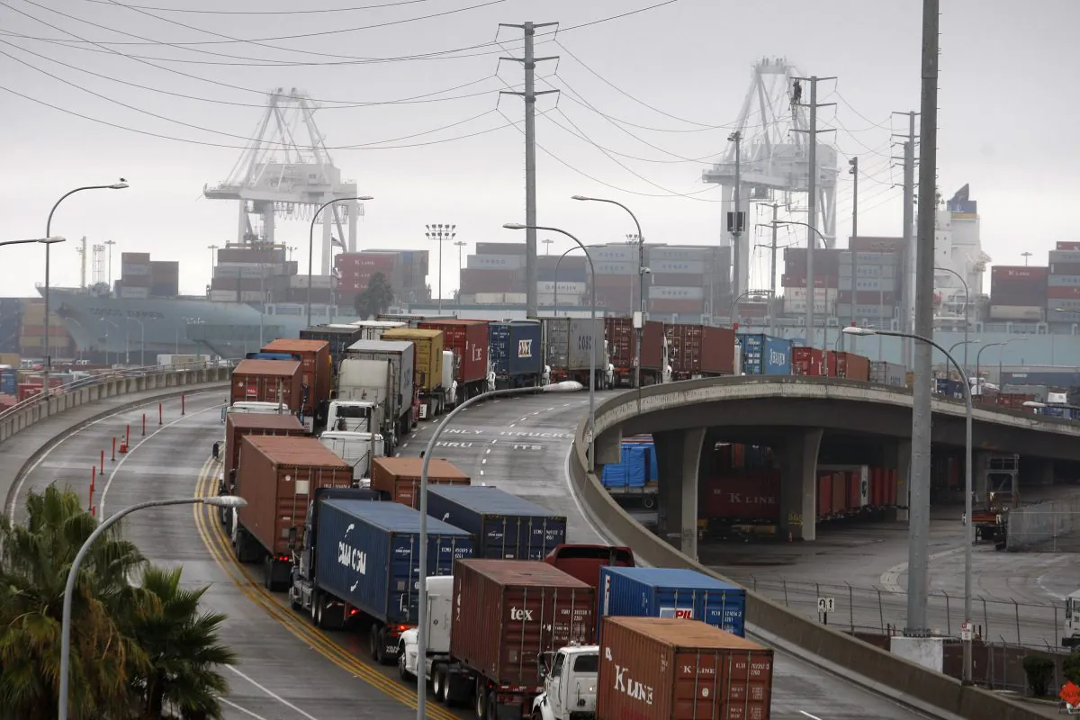 Shipping container trucks sit in traffic at the busiest seaport complex in the nation in Long Beach, Calif., on Nov. 29, 2012. (Photo by David McNew/Getty Images)