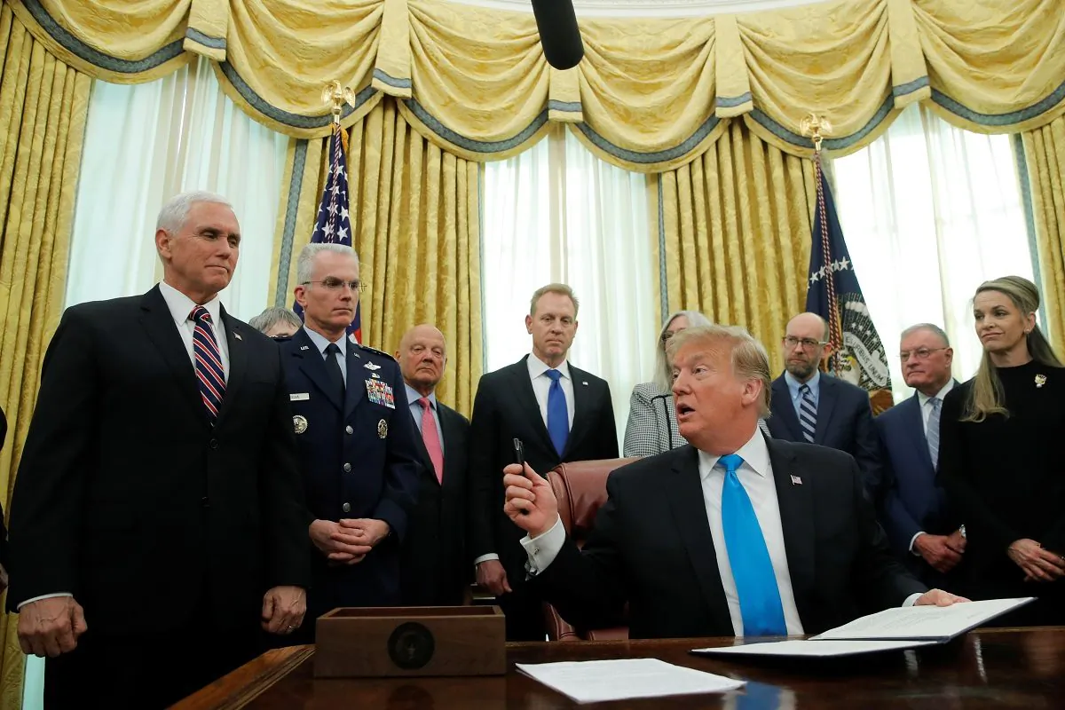 U.S. President Donald Trump looks to Vice President Mike Pence as he participates in a signing ceremony of "Space Policy Directive 4," to establish a Space Force as the sixth branch of the Armed Forces, in the Oval Office at the White House in Washington, U.S., on Feb. 19, 2019. (Jim Young/REUTERS)