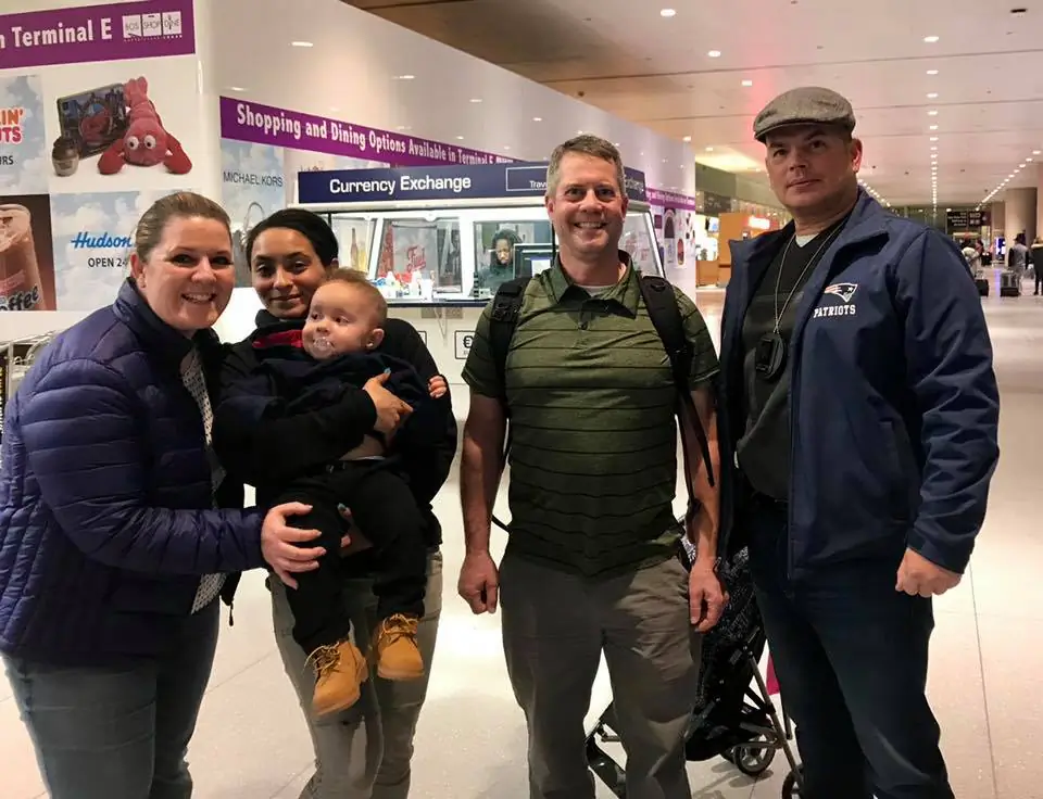 The boy was reunited with his mother, Mahalia Alexander-Paggi, Sunday night at Logan International Airport in Boston. (Lowell Police Department)