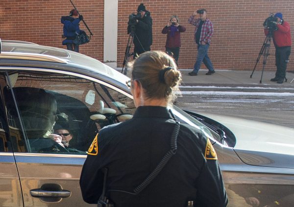 Krystal Jean Lee Kenney, left, leaves in a car 