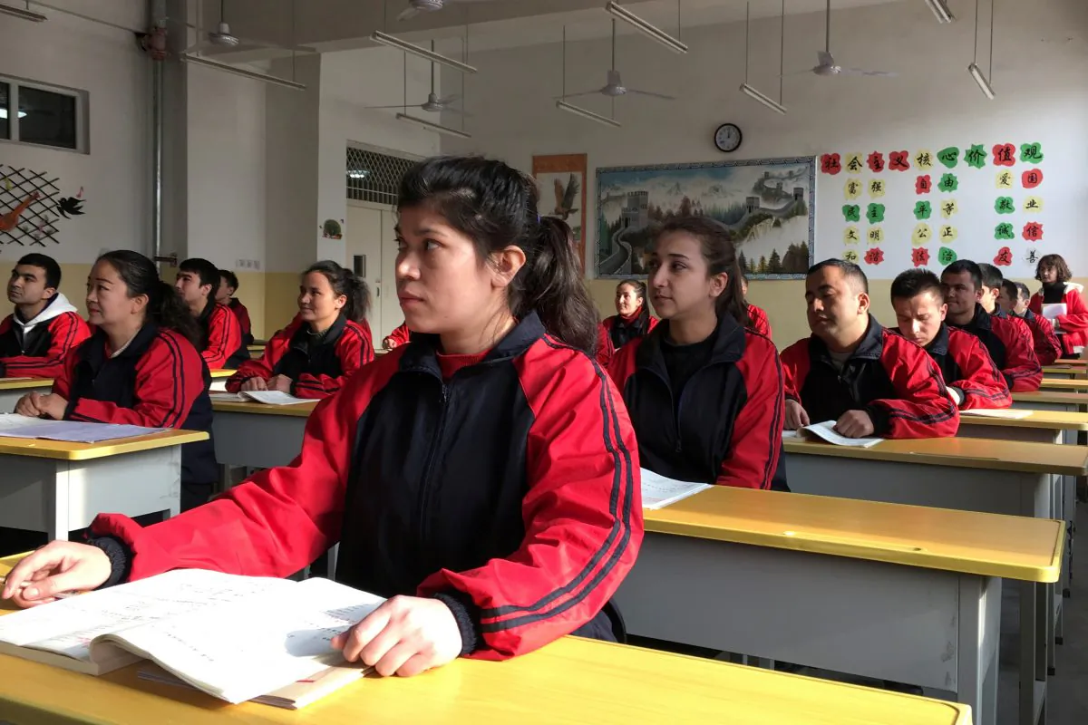 Residents at the Kashgar city vocational educational training center attend a Chinese lesson during a government organized visit in Kashgar, Xinjiang Uyghur Autonomous Region, China on Jan. 4, 2019. (Ben Blanchard/Reuters)